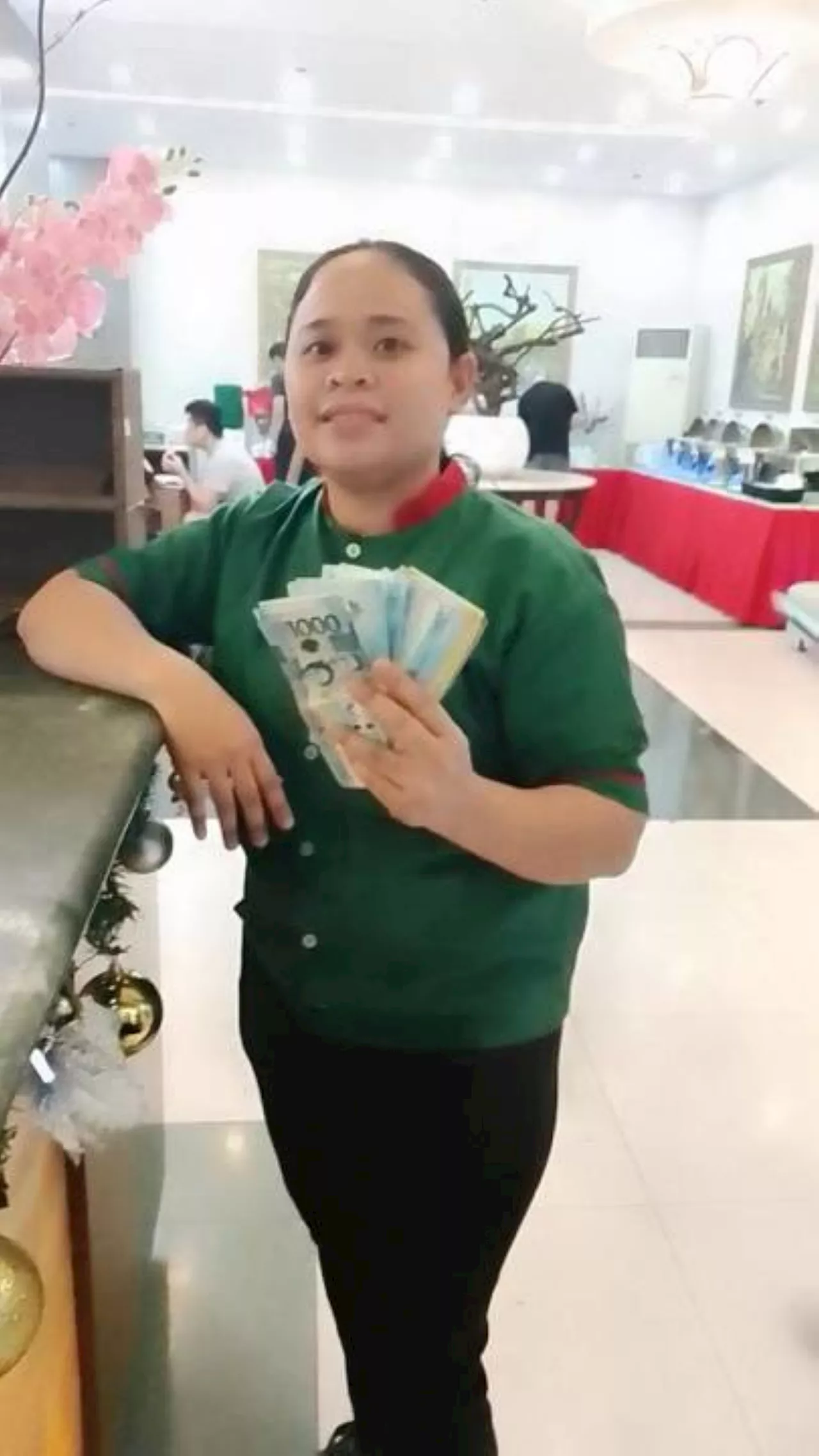 Honest Eurotel Angeles employee hands money left by guest