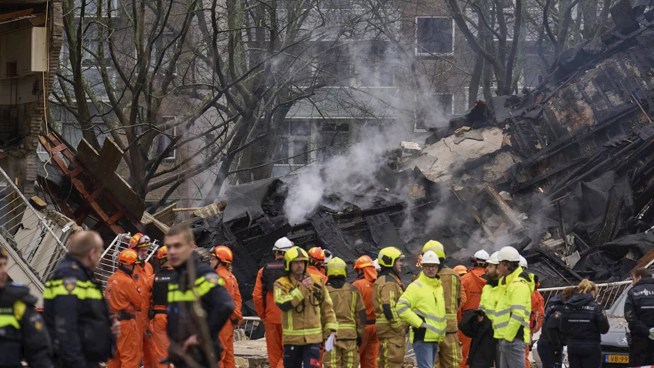 Rescuers search for victims after an explosion at a Dutch apartment block that killed at least 5