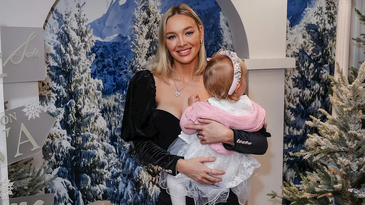 Roxy Horner flashes her toned figure in black corset top as she poses with her 14-month-old daughter...