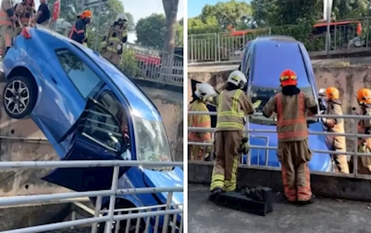 Car plunges into Queensway Shopping Centre basement carpark in Singapore, injuring 91-year-old and driver