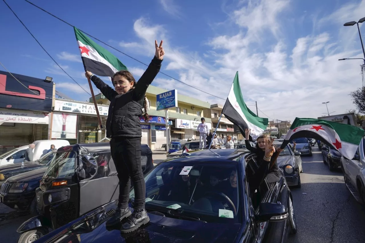 Jubilation and gunfire as Syrians celebrate the end of the Assad family's half-century rule