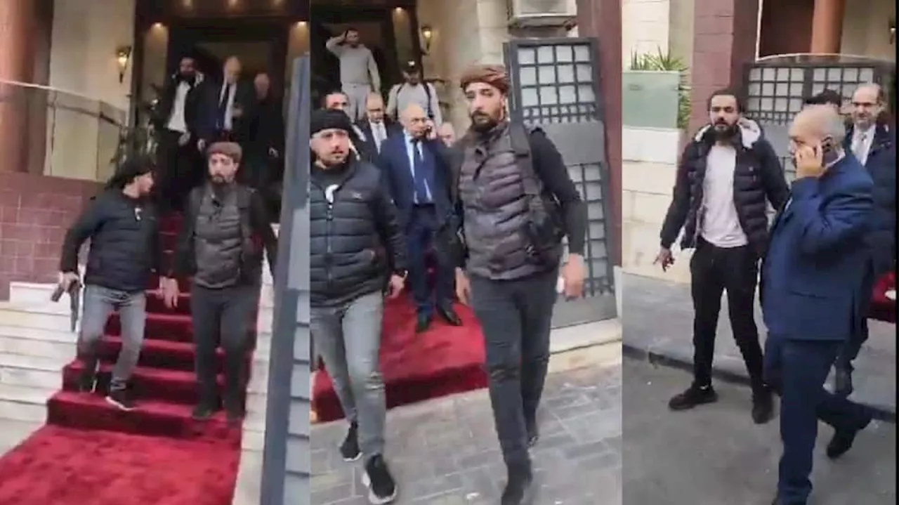 Watch: Rebels Escort Syrian Prime Minister Out Of Office As Assad Regime Falls