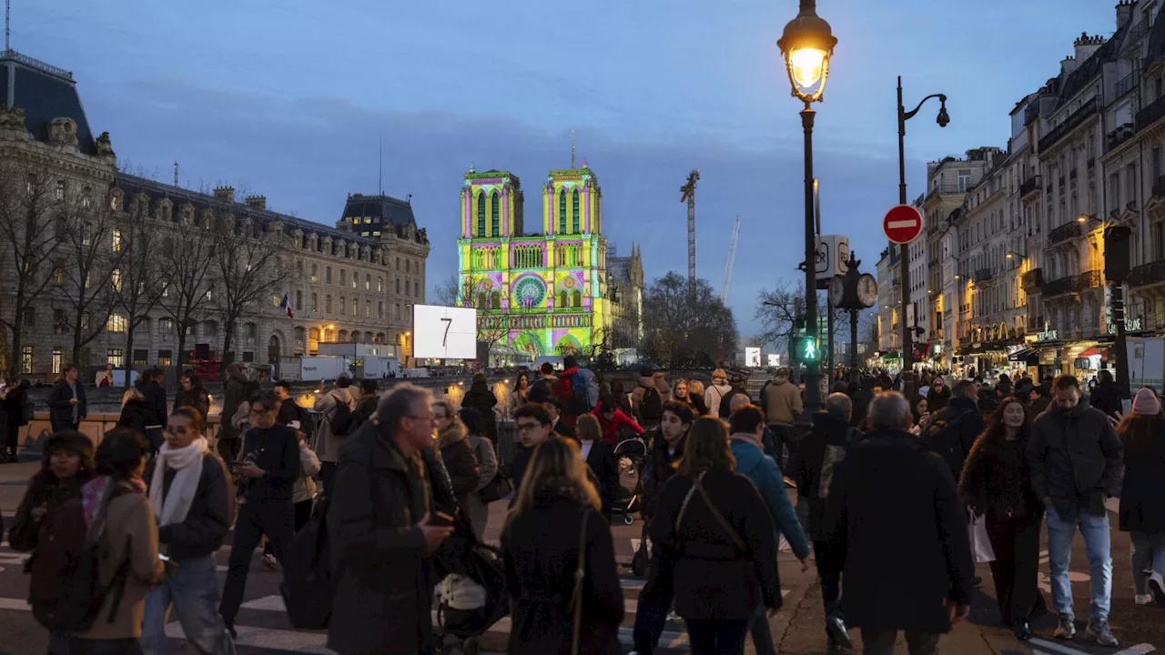 The Latest: The famed Notre Dame Cathedral in Paris reopens to great fanfare