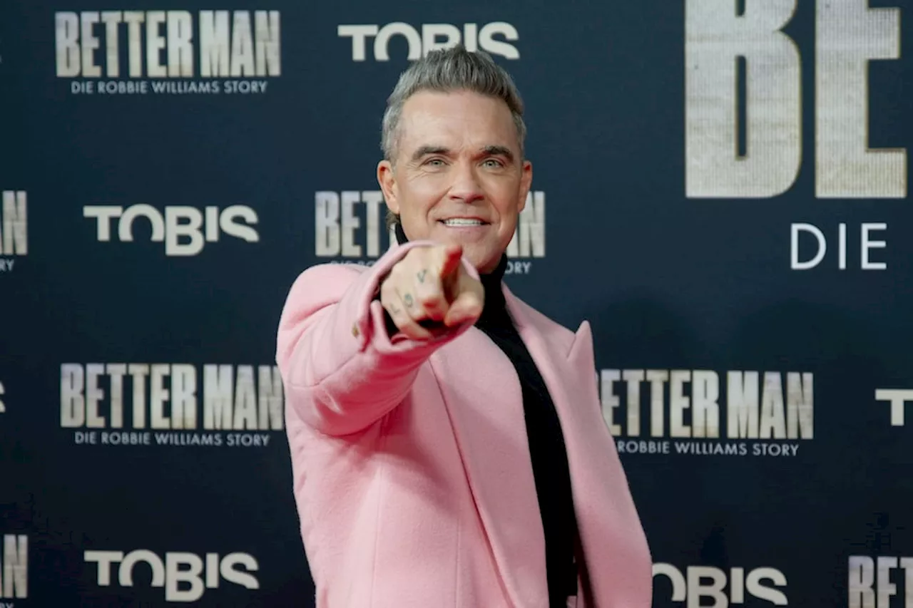 – das kostet Robbie Williams rosafarbener Mantel