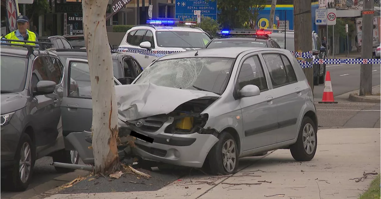 Man charged after woman allegedly hit by car on Sydney footpath