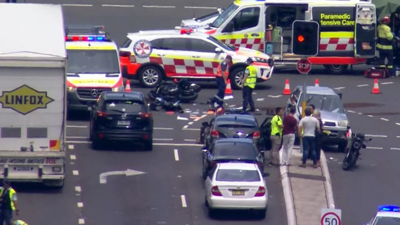 Rider critical after car and motorbike crash closes parts of Epping and Herring Rds at Macquarie Park, in Sydney’s northwest