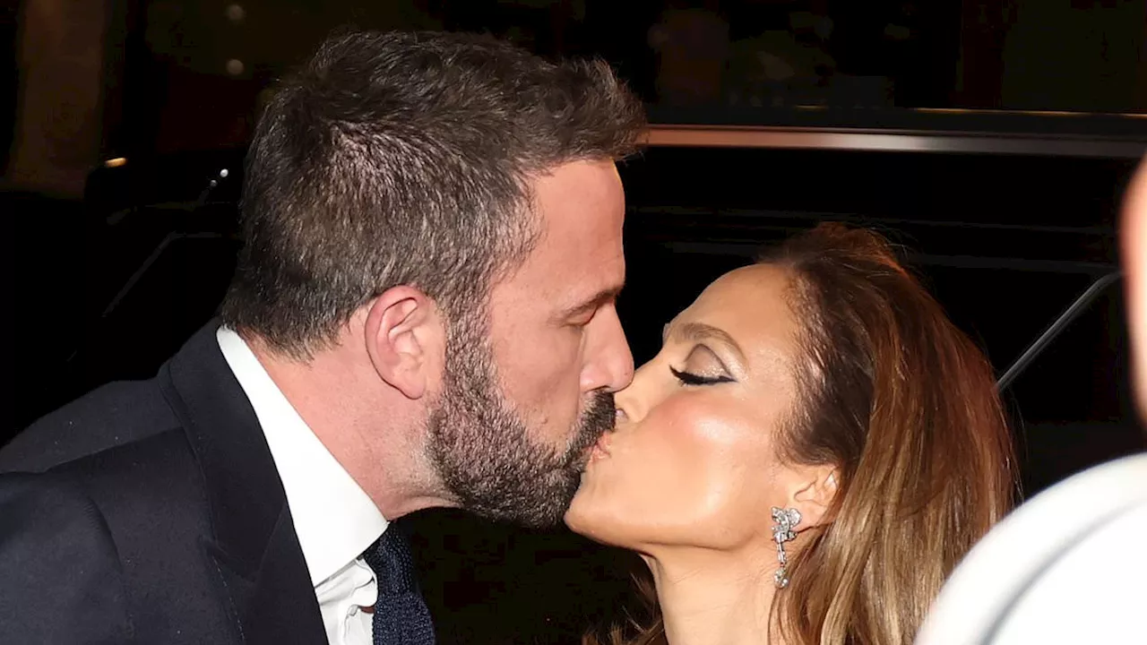 Jennifer Lopez shares sweet smooch with husband Ben Affleck as she shows off her legs in sheer...