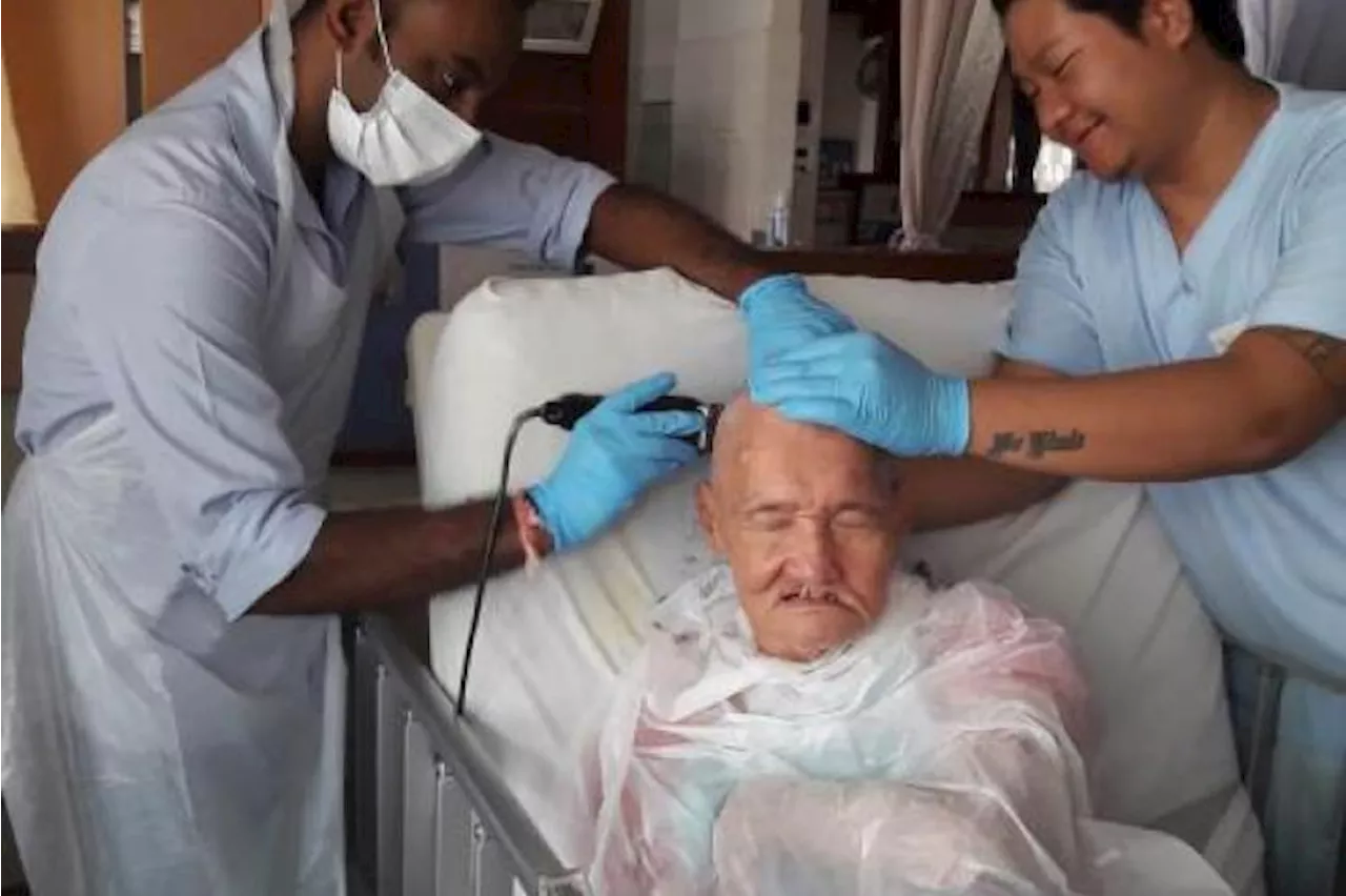 Disabled elderly get free haircuts at Indian Barber Shop