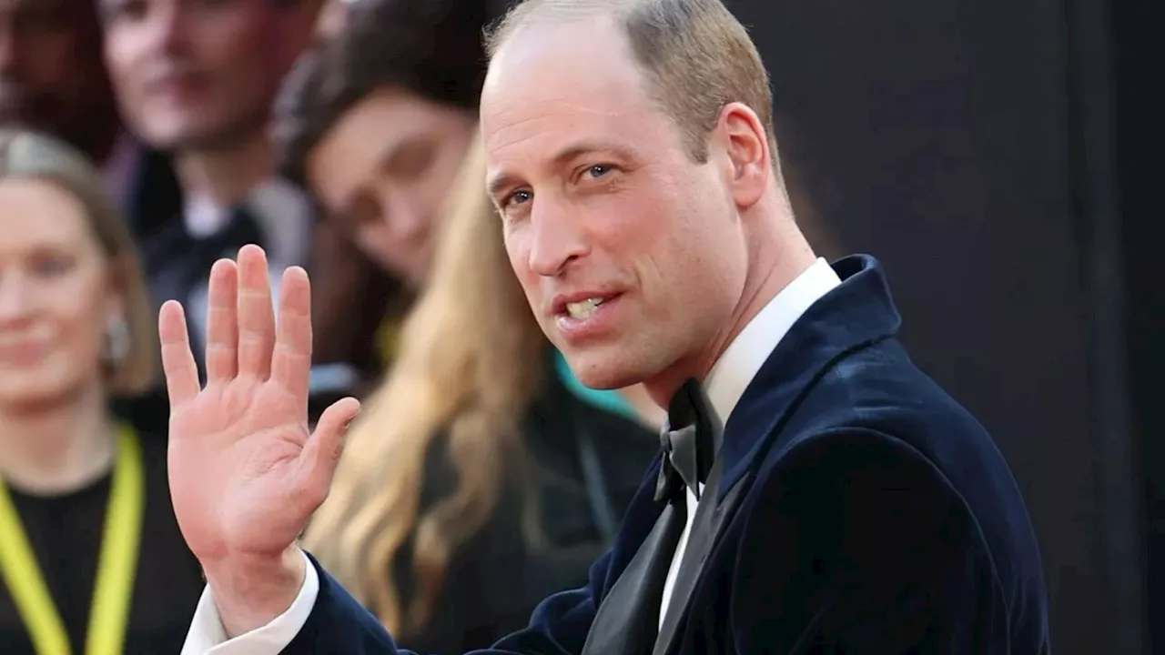 Prince William greets fans at Baftas while Kate Middleton recovers from surgery at home...