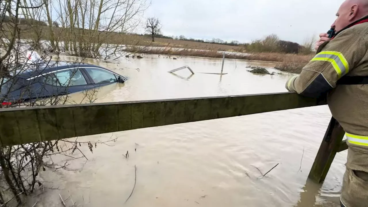 Firefighter looks on while driving instructor’s car sinks in 4ft flood ‘because crew can only to go in up...