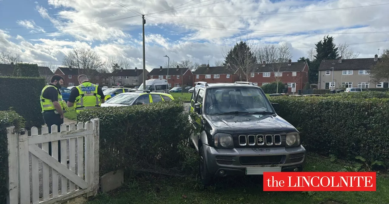 Man arrested after car crashes in garden of Lincoln house