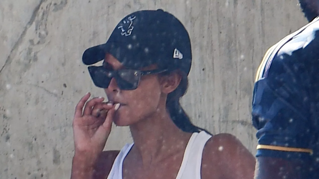 Love Island superstar Maya Jama smokes ‘roll-up ciggie’ with rap icon boyfriend Stormzy outside airport in...