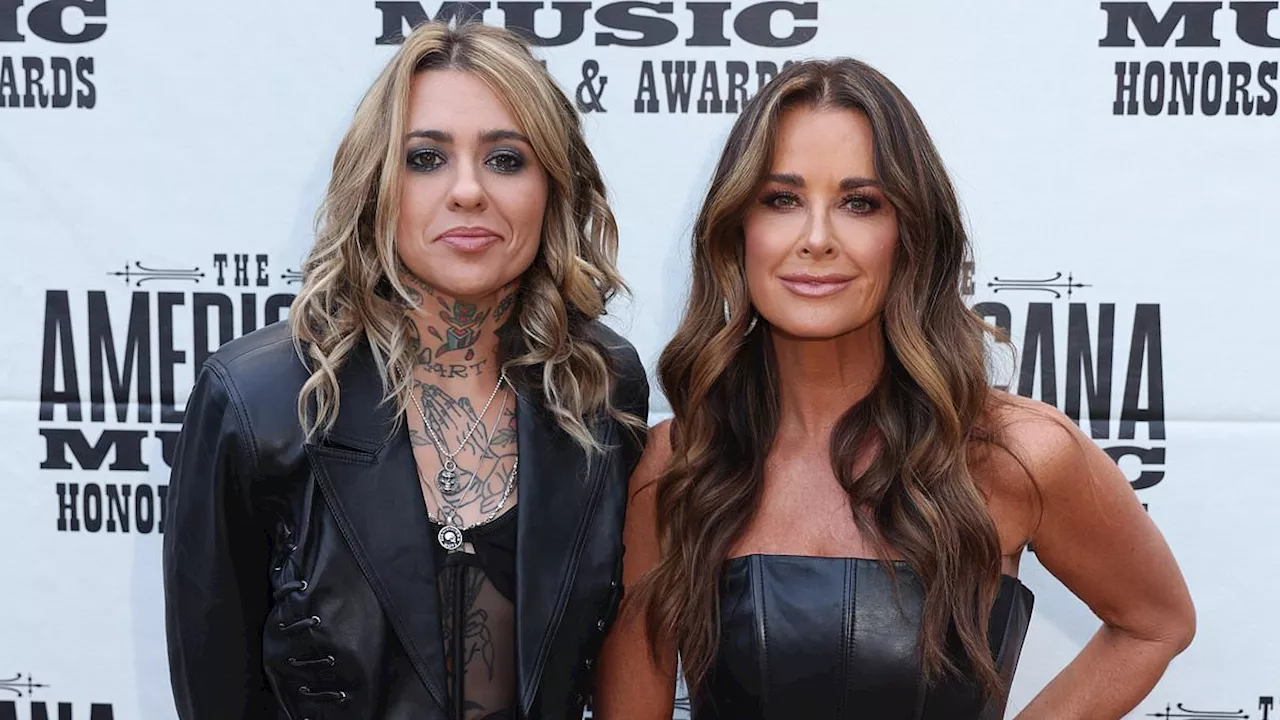 Kyle Richards is CARESSED by Morgan Wade as they keep mum over romance rumors