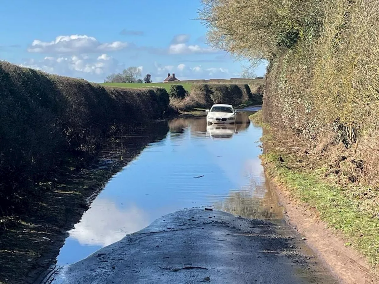 Fire crews rescue car from flood water near Newport and warn drivers not to risk it