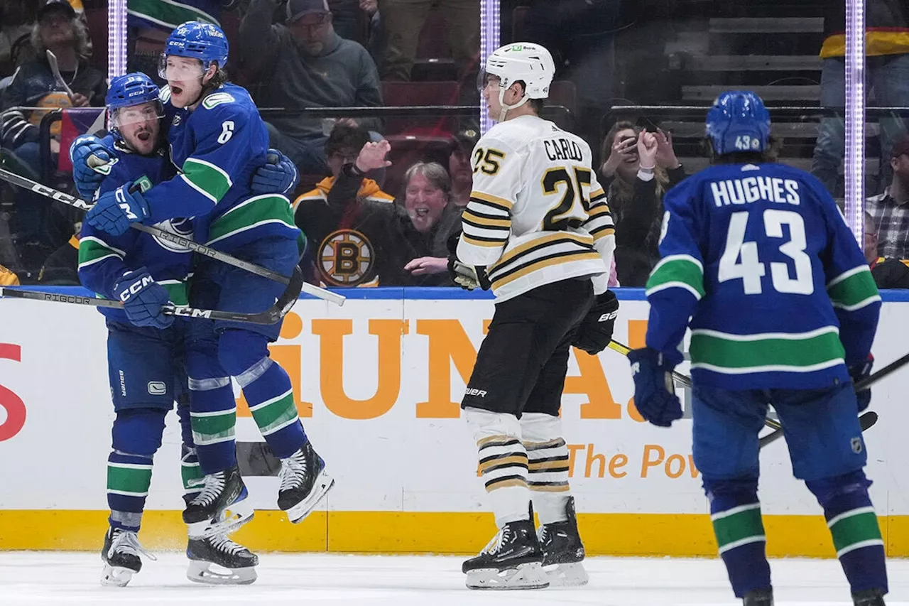 Boeser scores OT winner as Canucks rally to edge Boston Bruins 3-2