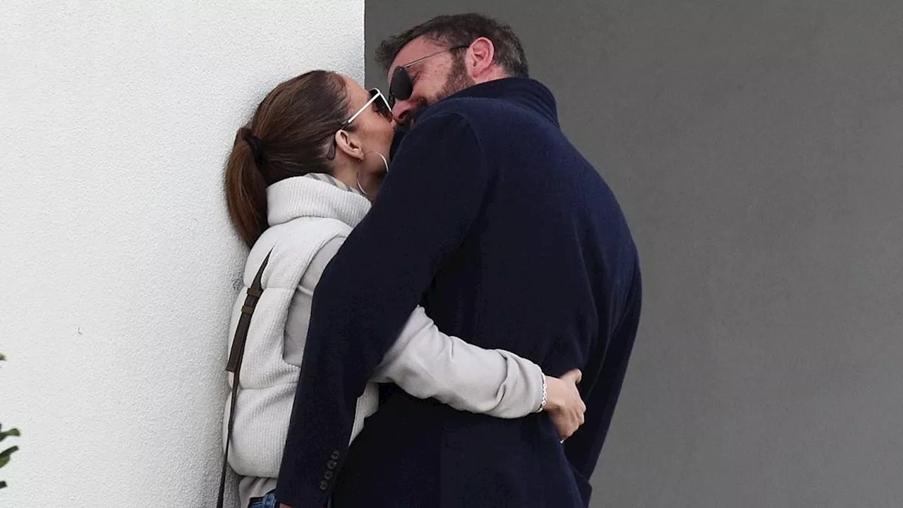 Ben Affleck and Jennifer Lopez put on a VERY passionate display in public as they kiss and cuddle up...