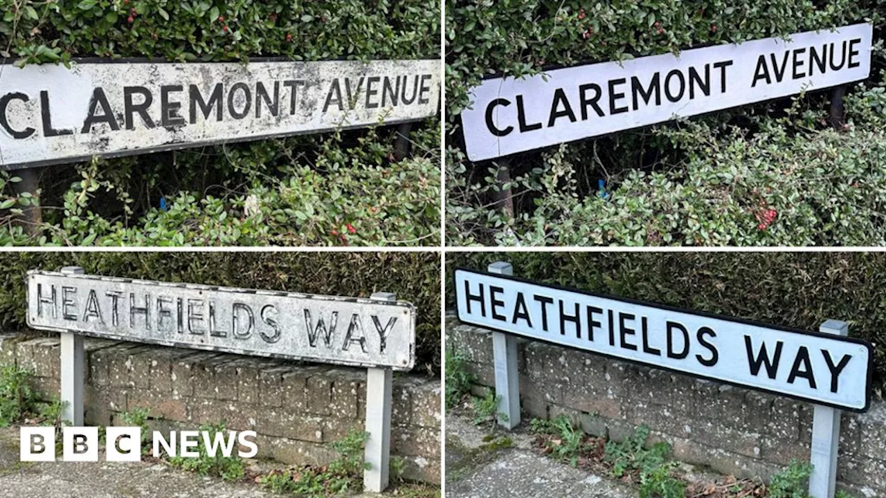 Volunteer cleans and paints street signs in north Dorset