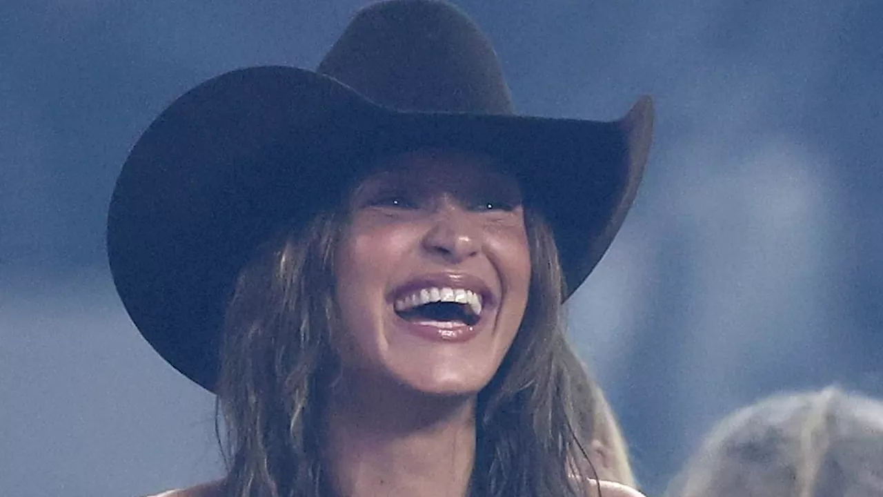 Bella Hadid embraces Western fashion in a cowboy hat as she cheers on boyfriend Adan Banuelos at...