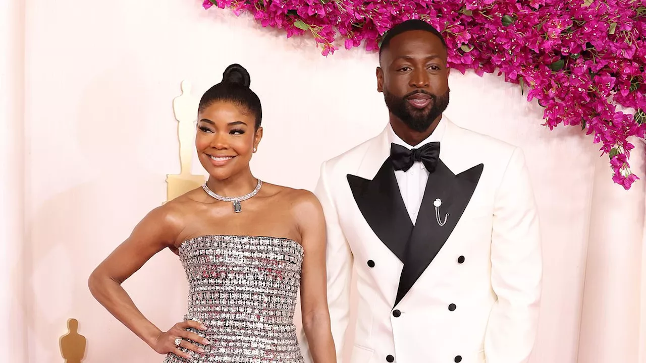 Oscars 2024: Gabrielle Union dazzles in glittering dress as she holds hands with her suited-up...