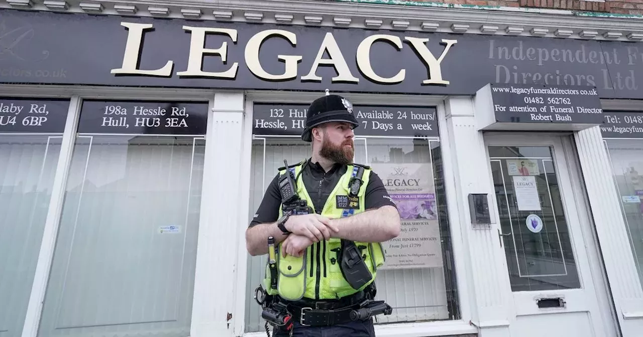 Two arrested after police remove 34 bodies from funeral directors