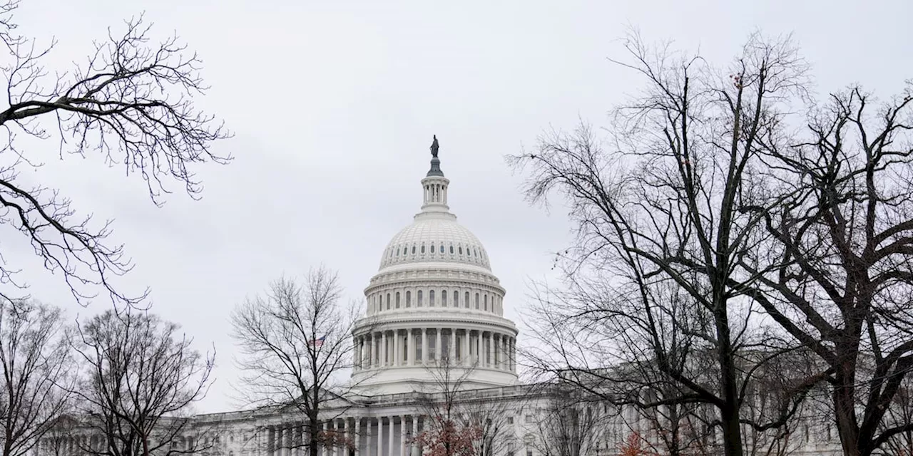 Biden signs a package of spending bills passed by Congress just hours before a shutdown deadline