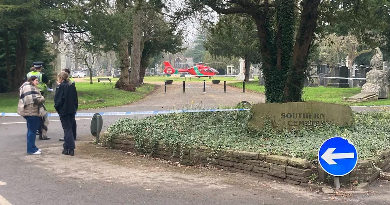 LIVE: Cordon in place at Manchester cemetery with police and air ambulance at scene