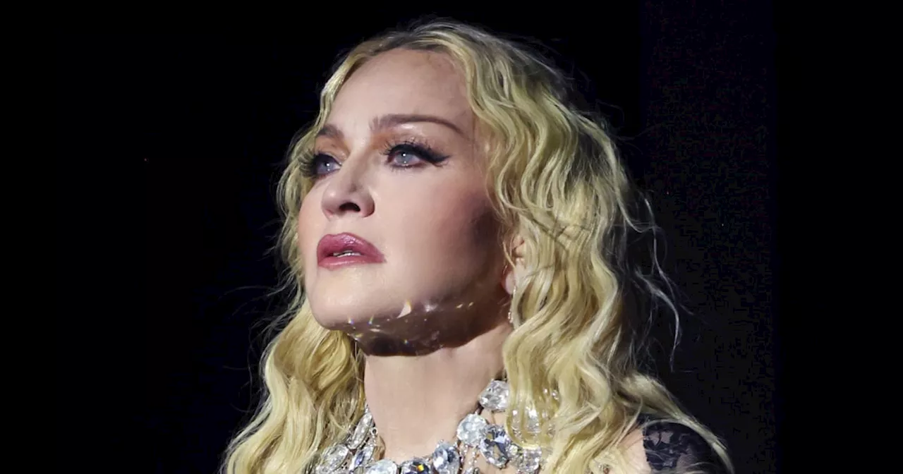 Madonna calls out fan for sitting during concert before realizing they were in wheelchair