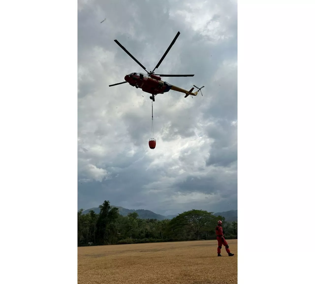 Bomba deploys helicopter from Miri to help put out open fires in Sabah