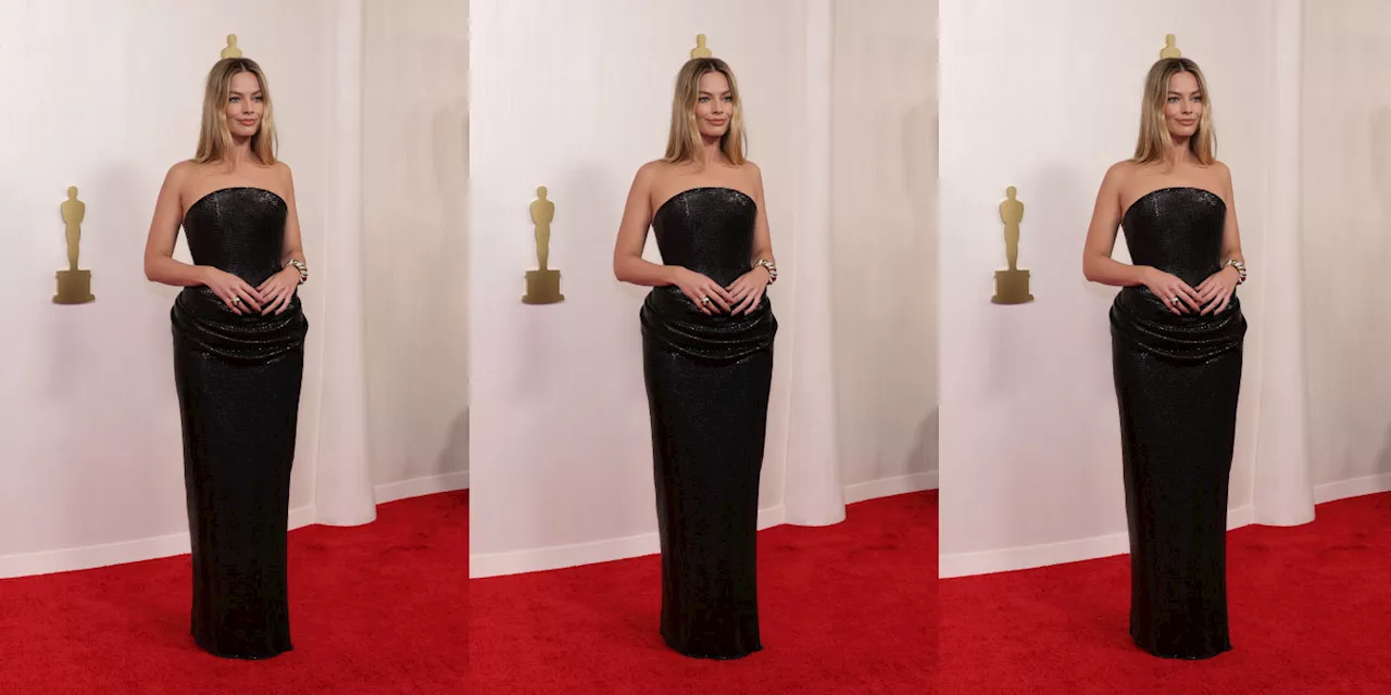 Margot Robbie Forgoes Barbie Colours in a Black Versace Gown at the 2024 Oscars