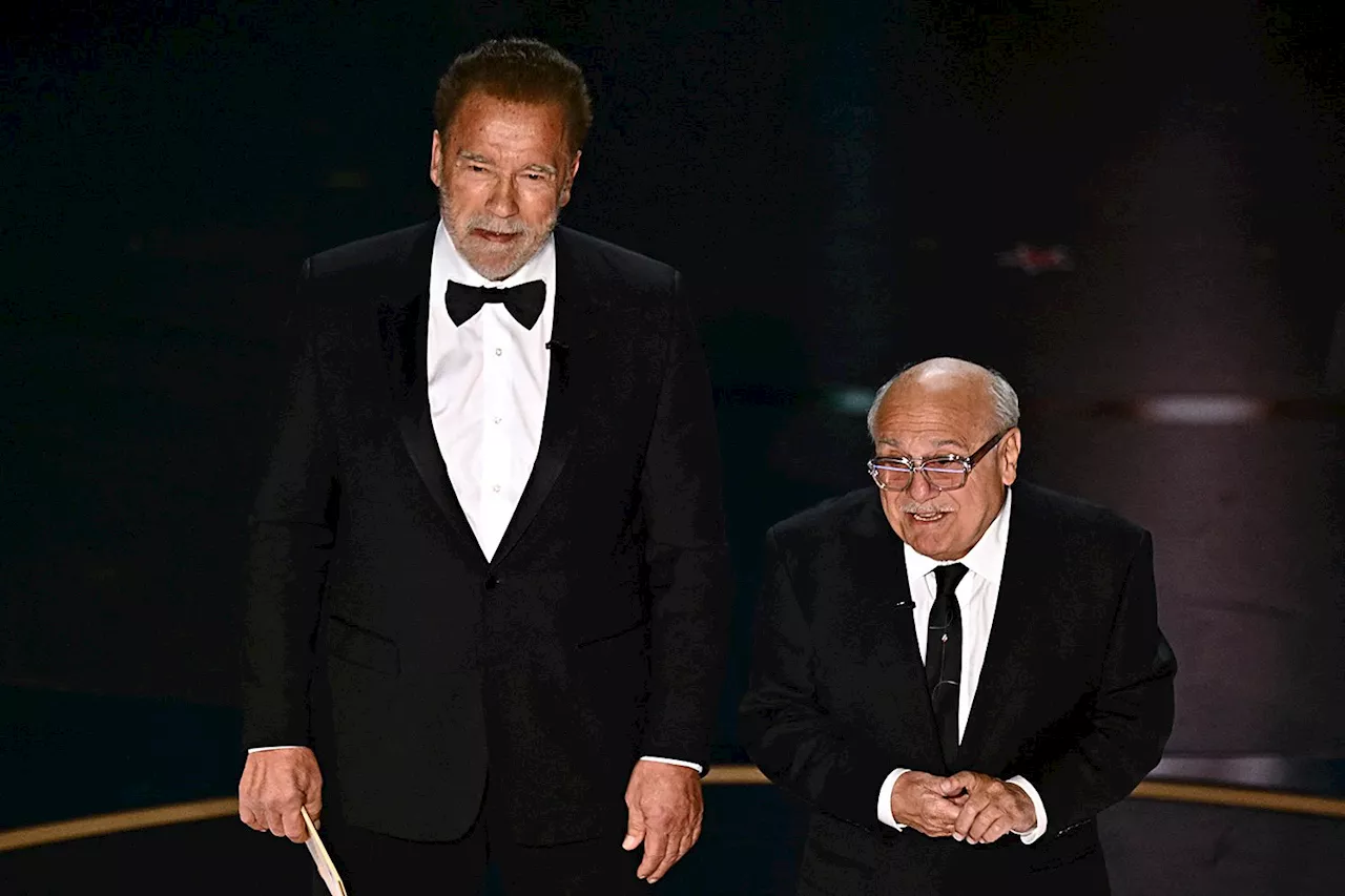 Former Batman villains Arnold Schwarzenegger and Danny DeVito reunite at Oscars and tease Michael Keaton