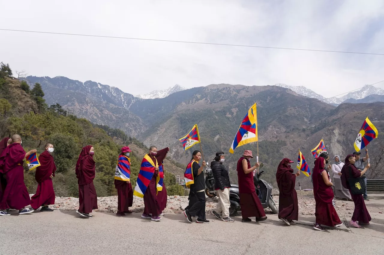 Hundreds of Tibetans march on New Delhi streets asking China to leave Tibet on uprising anniversary