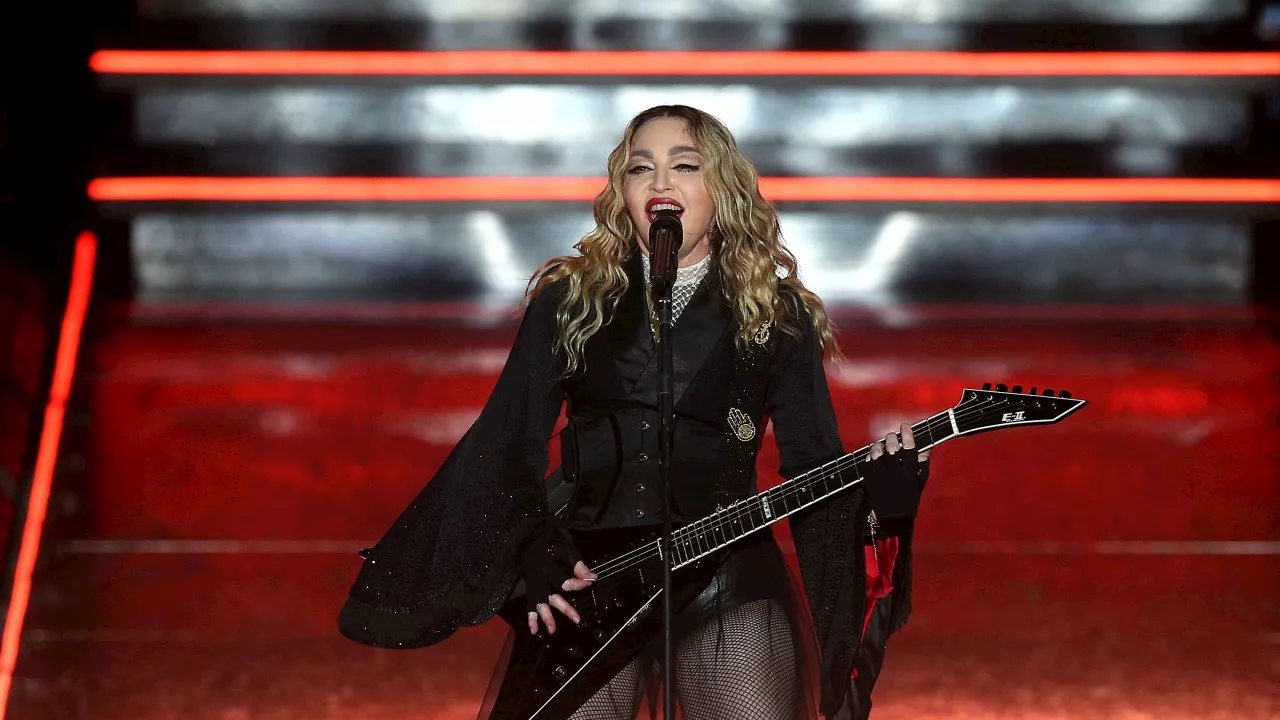 Madonna calls out concertgoer for sitting down – only to see fan is in a wheelchair