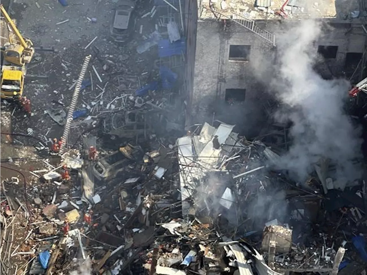 An explosion in a building outside Beijing kills 2 people and injures 26