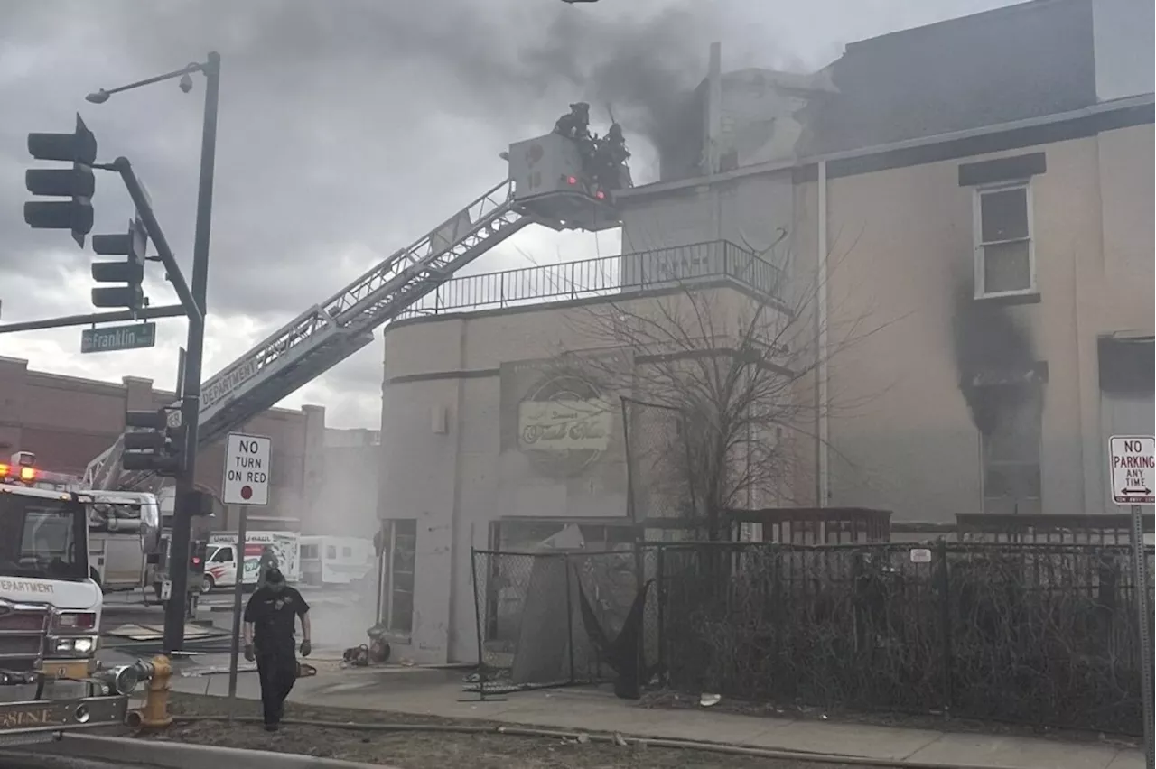 East Colfax in Denver closed in both directions as firefighters battle abandoned house fire