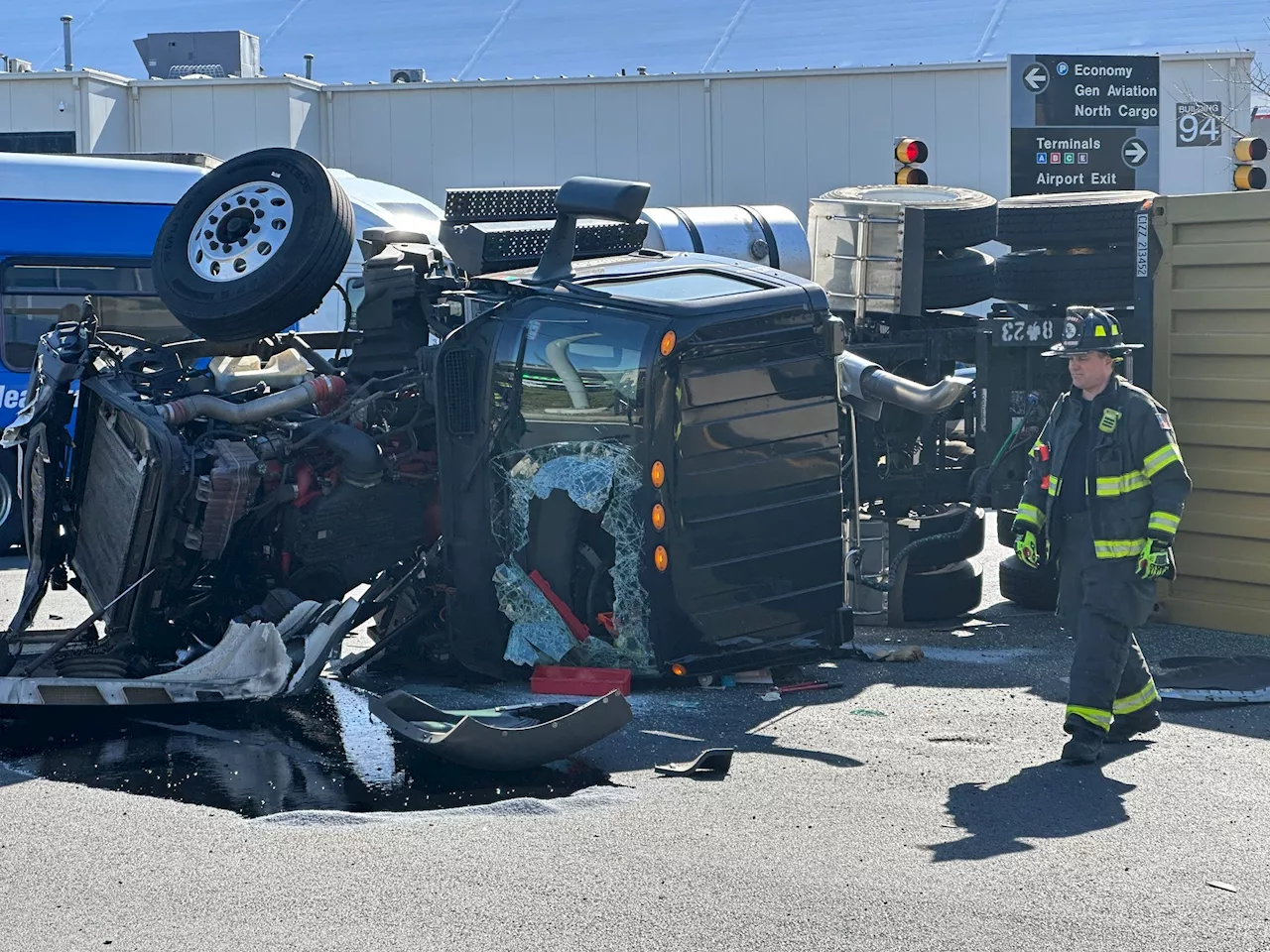 Truck rolls over near Boston's Logan airport, driver hospitalized