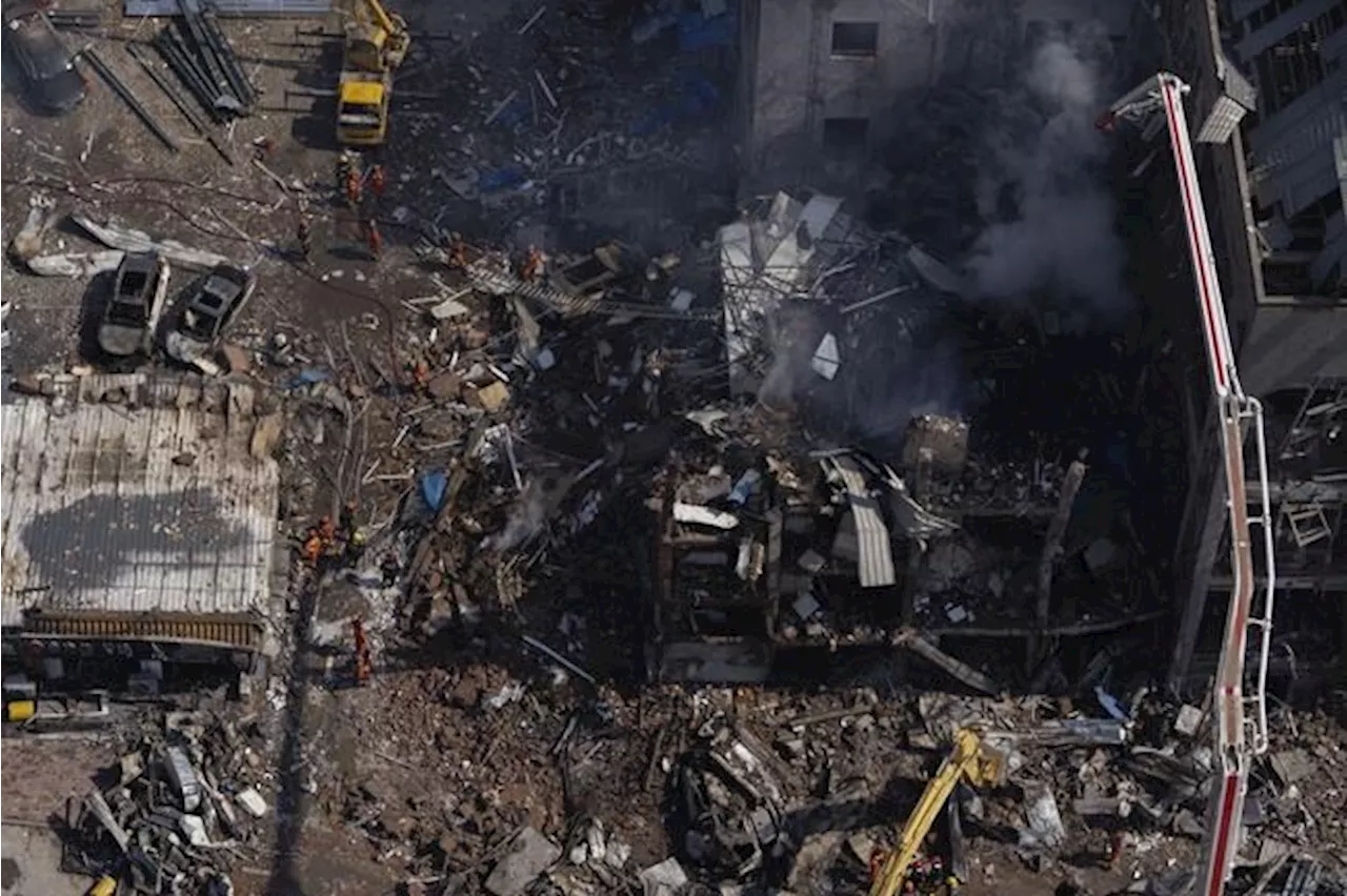 An explosion in a building outside Beijing kills 2 people and injures 26