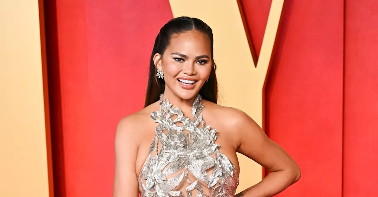 Chrissy Teigen Embraces Her ‘Boob Lift Scars’ in Sheer Dress