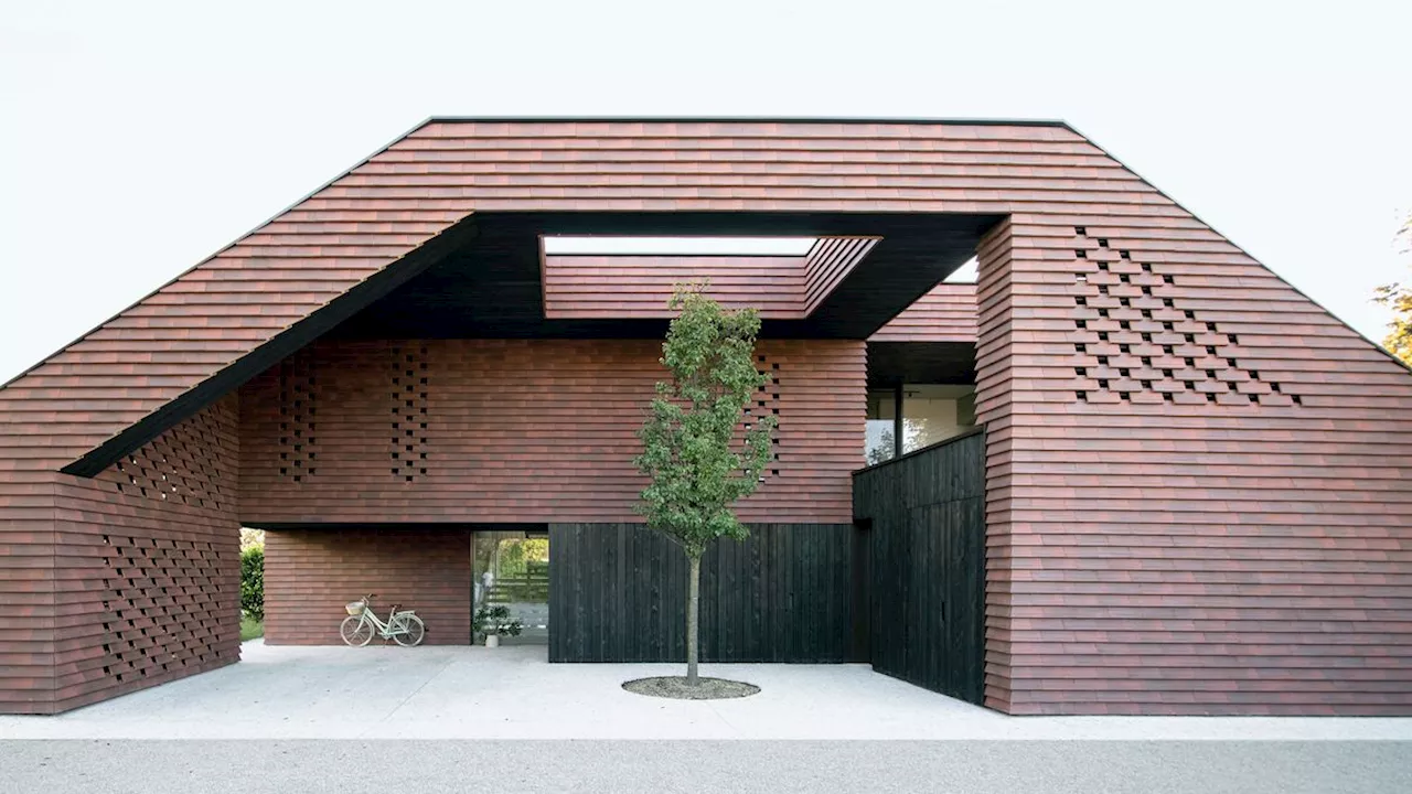 Frame House is a family home that appears carved from a solid block