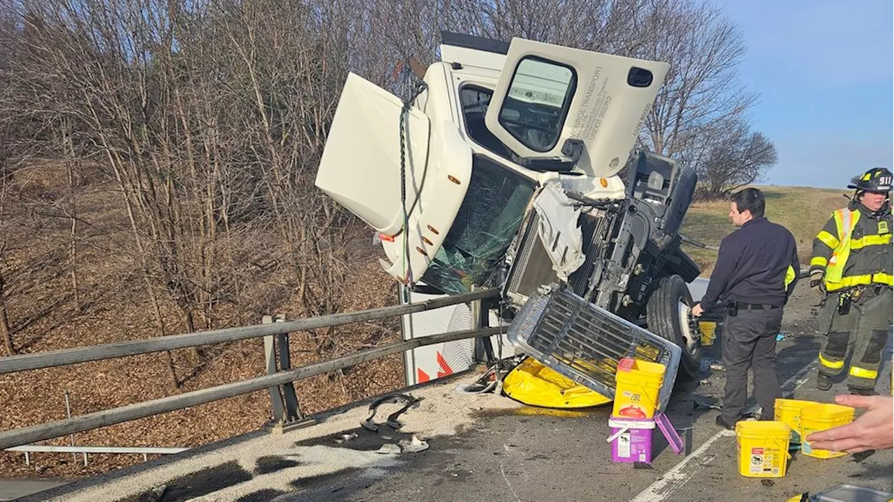 Tractor-trailer dangling off bridge following crash on Thruway in Pittsford