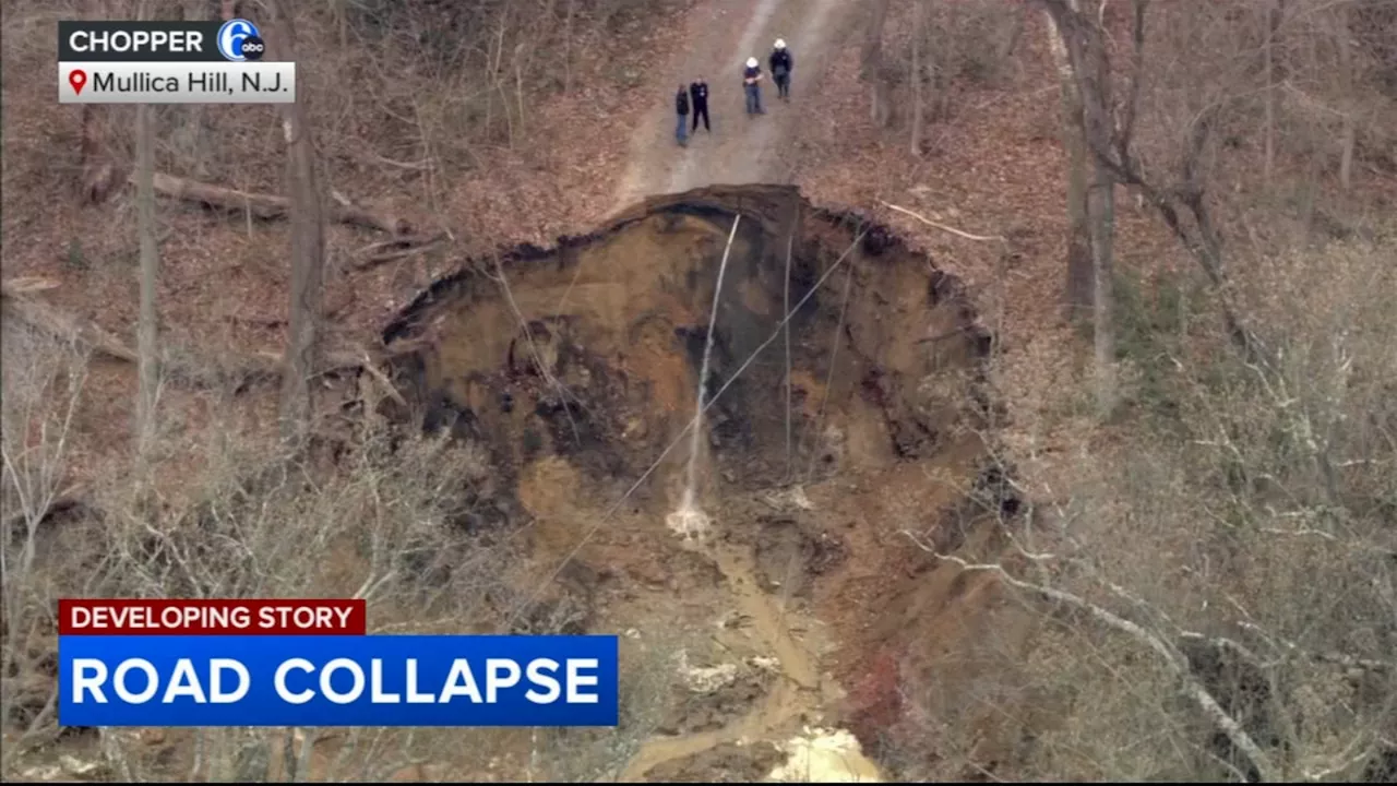 Water built up by clogged pipes leads to road collapse, leaving New Jersey homes stranded