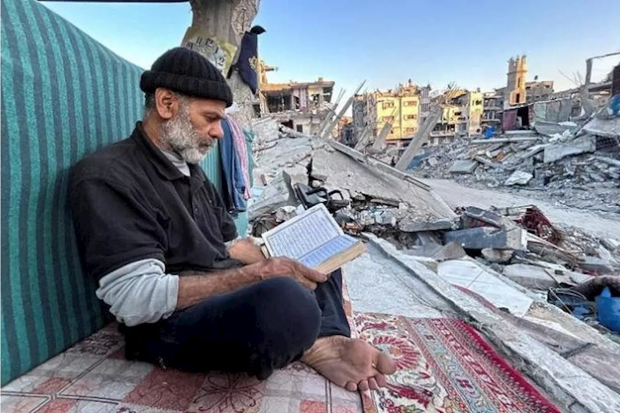 Gaza's displaced break fast with canned food in the rubble