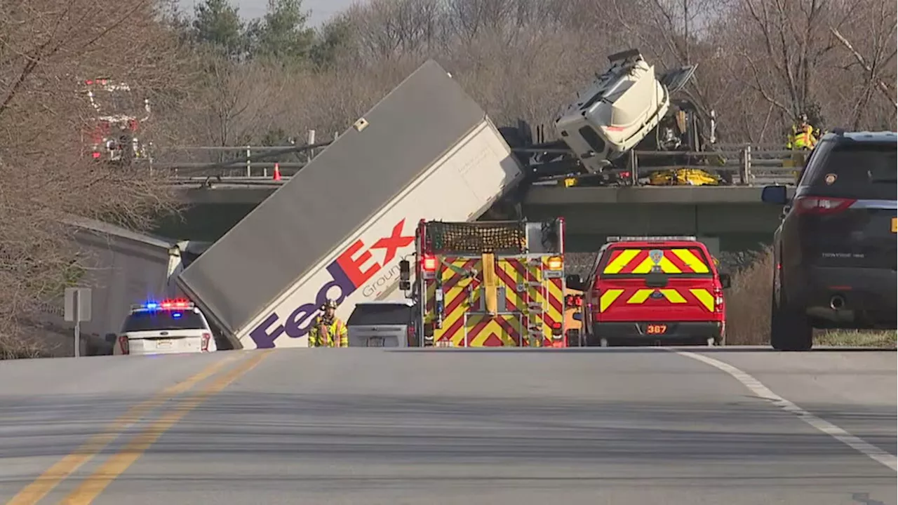 UPDATE: Tractor-trailer dangling off bridge following crash on Thruway in Pittsford