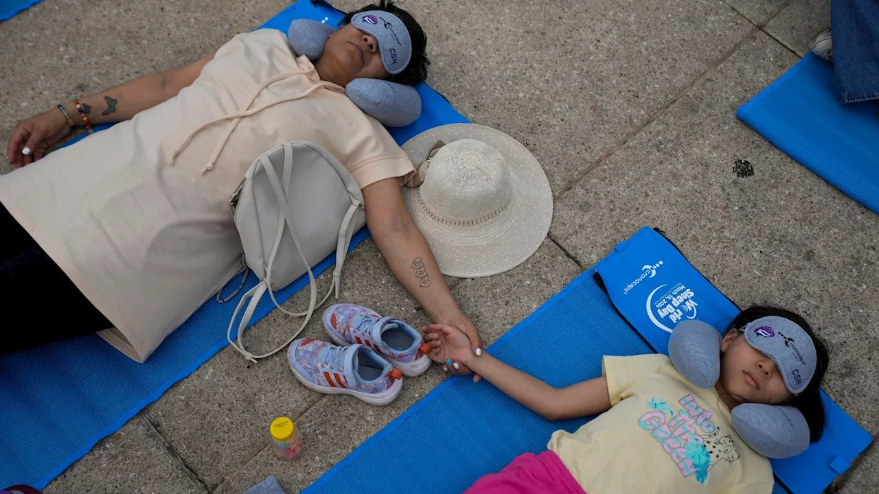 Hundreds in Mexico City stretch out for a 'mass nap' to commemorate World Sleep Day