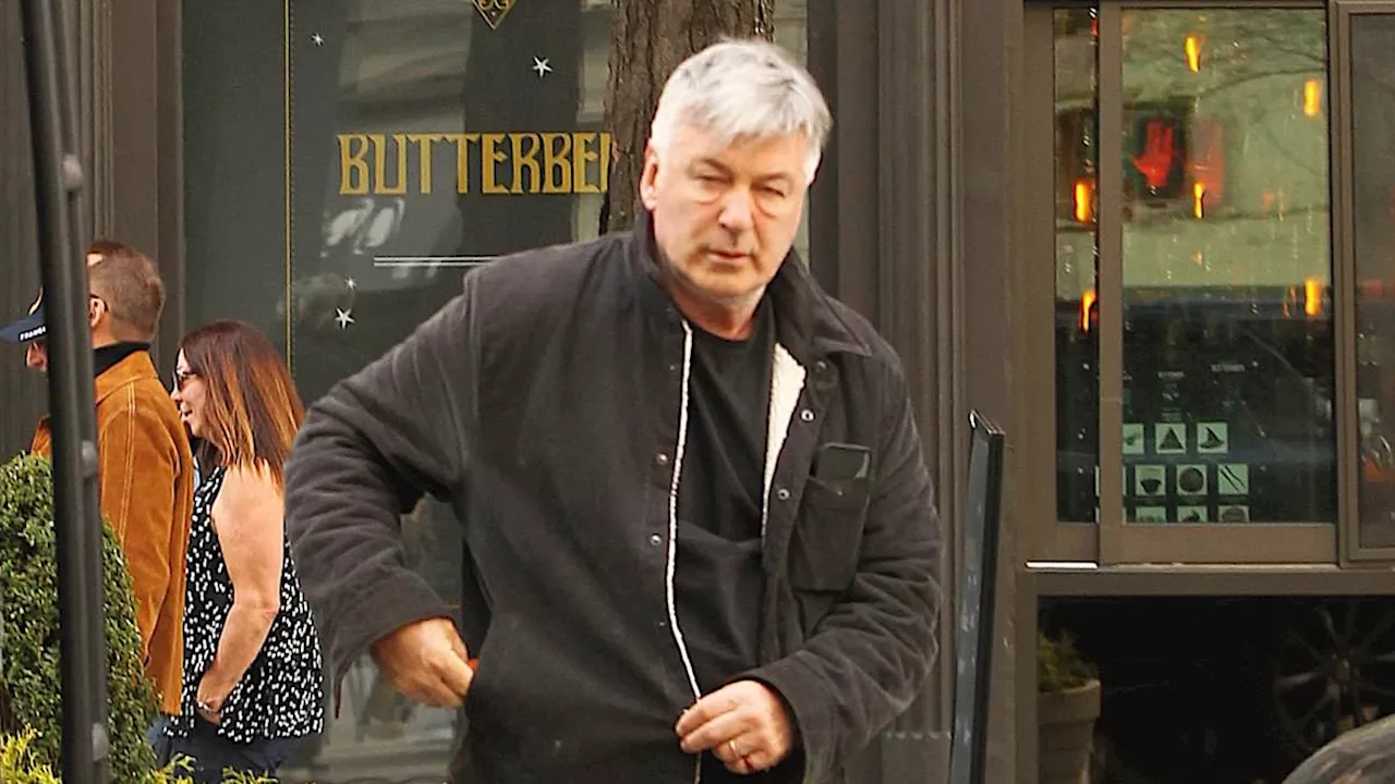 Alec Baldwin looks downcast while heading into a lawyer's office in NYC amid claims he wants to be...