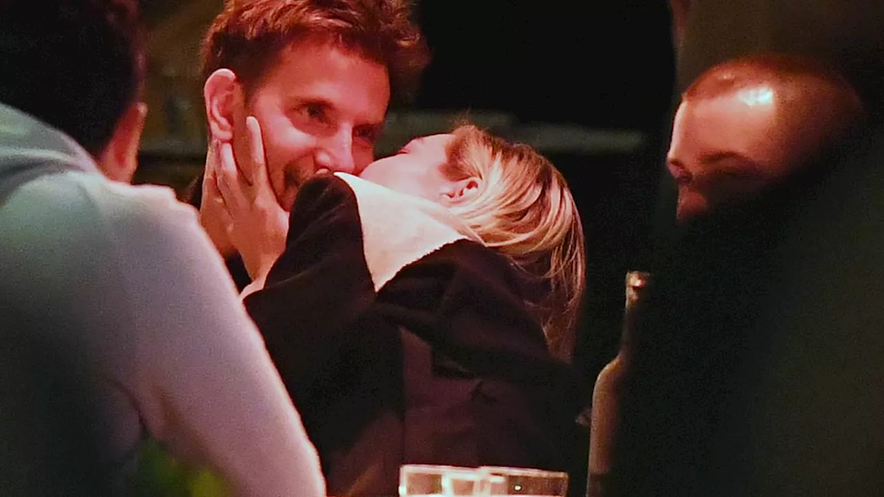 Bradley Cooper and Gigi Hadid get VERY passionate with each other over dinner with friends