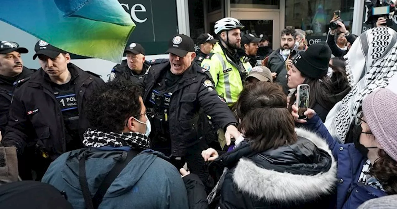 Police arrest two at protest that delayed Trudeau event, including Rebel News host