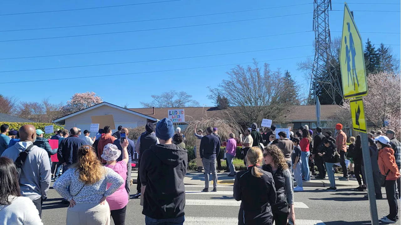 Landlords protest outside Bellevue rental home over tenant's nonpayment of rent