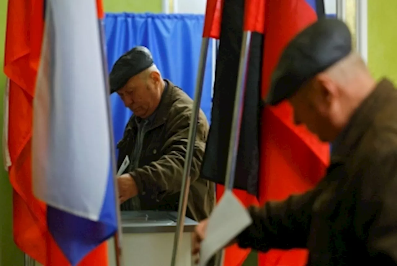 Ukraine strikes Russian city and refinery on day two of presidential vote