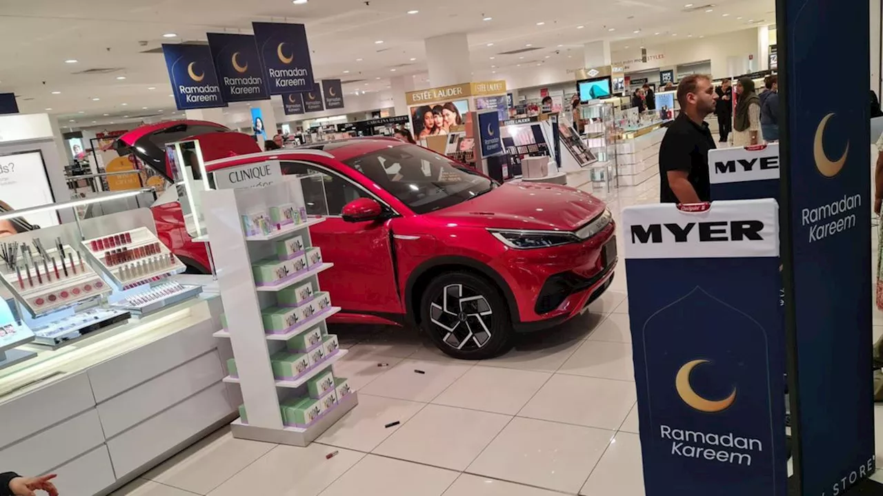 Electric car displayed in shopping centre crashes into store, two hospitalised