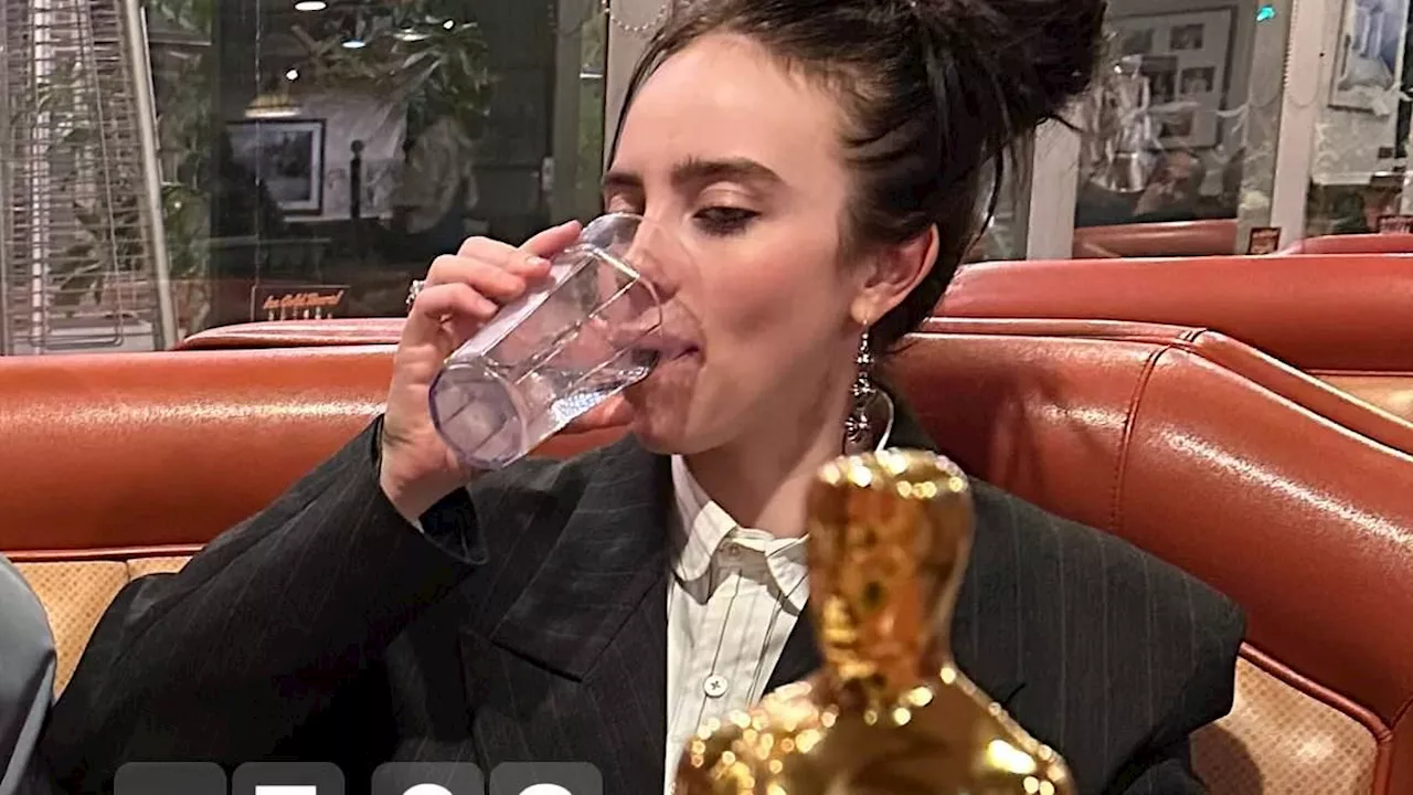 Billie Eilish shares she was up to almost 6AM partying after the Oscars as she is seen with her...